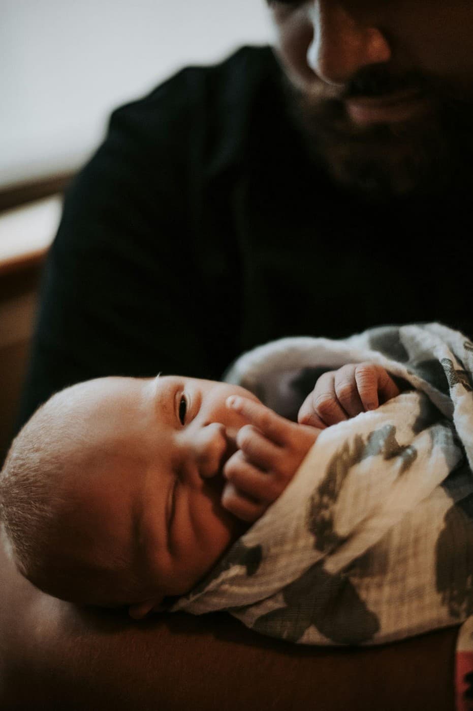 A father holding a newborn