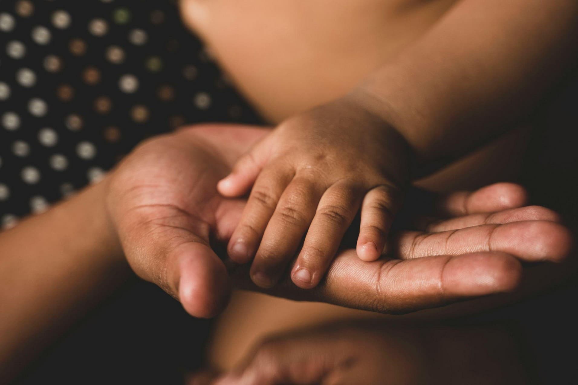 A mother resting her hands in a quiet moment
